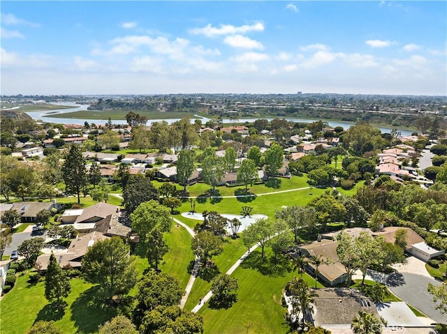 drone / aerial view featuring a residential view and a water view