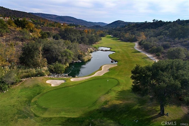 aerial view with a view of trees and a water and mountain view