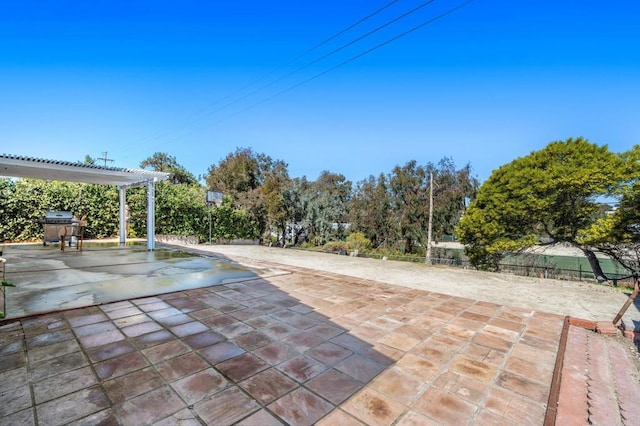 view of pool featuring fence, a patio, grilling area, and a pergola