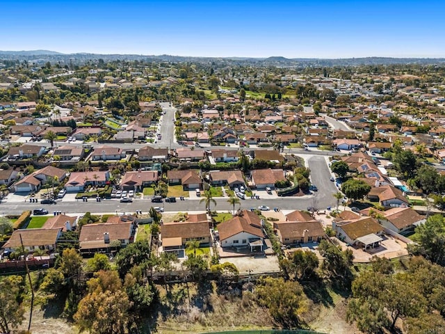 birds eye view of property with a residential view and a mountain view