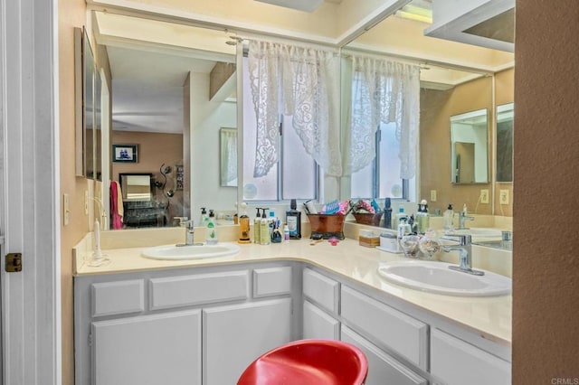 bathroom with double vanity and a sink