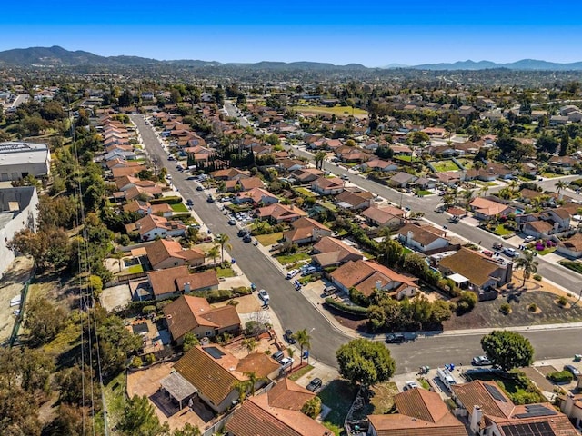 birds eye view of property with a residential view and a mountain view