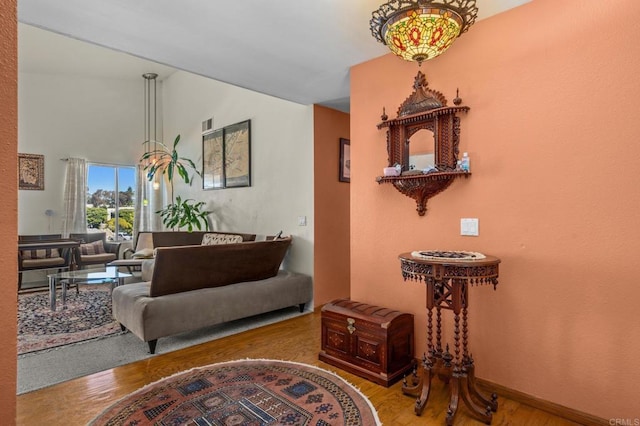 interior space featuring visible vents, baseboards, and wood finished floors