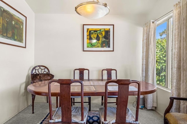 dining area with carpet flooring and plenty of natural light