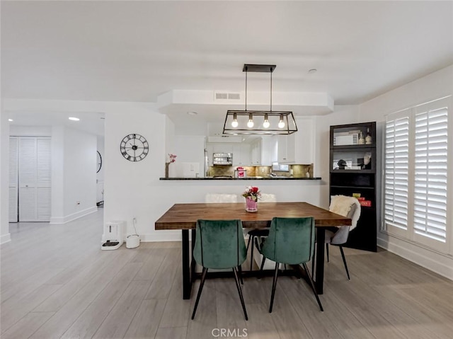 7249 Franklin Ave Unit 205, Hollywood Hills, CA 90046 - dining space with baseboards, wood finished floors, and recessed lighting