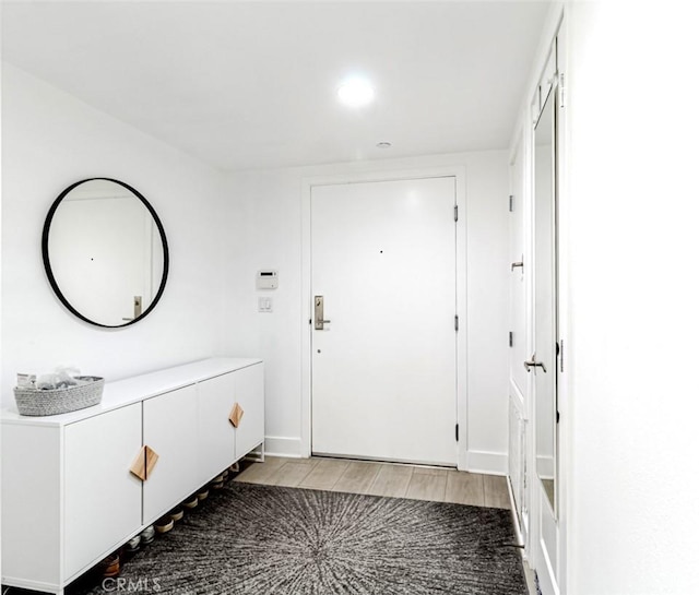 7249 Franklin Ave Unit 205, Hollywood Hills, CA 90046 - foyer entrance featuring light wood finished floors, recessed lighting, and baseboards