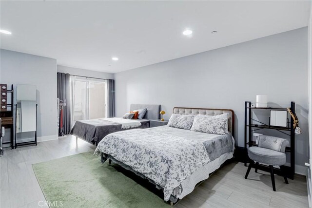7249 Franklin Ave Unit 205, Hollywood Hills, CA 90046 - bedroom with light wood-type flooring, recessed lighting, and baseboards