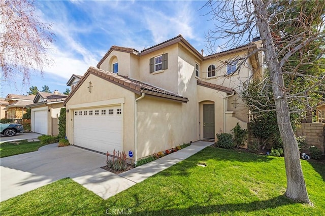 mediterranean / spanish house featuring driveway, a tiled roof, an attached garage, a front lawn, and stucco siding