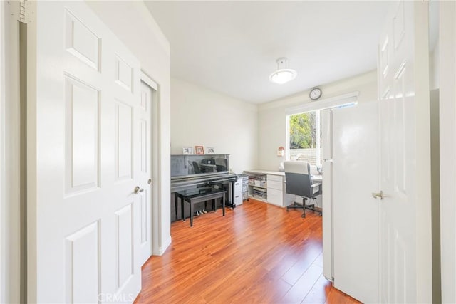 home office featuring light wood finished floors