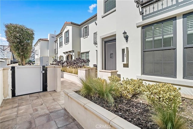 exterior space featuring a residential view and stucco siding