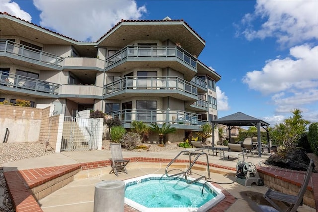 view of pool with a gazebo and a patio