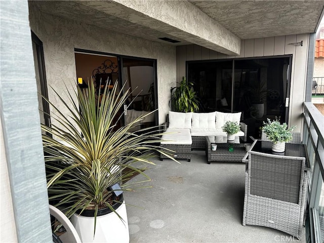 view of patio / terrace with visible vents, an outdoor living space, and a balcony