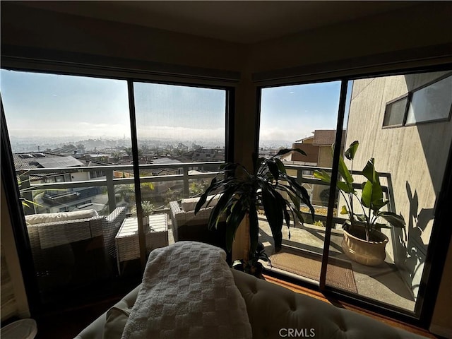 sunroom featuring a residential view