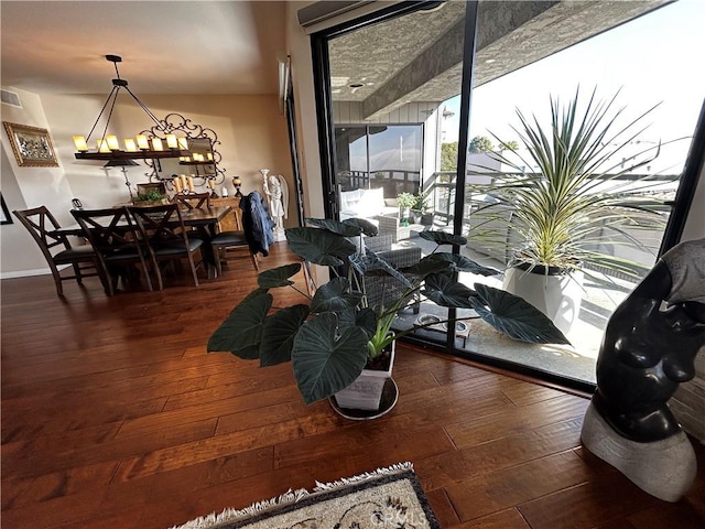 dining space with dark wood-style floors, visible vents, and baseboards