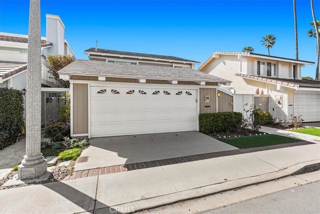 view of front of home with driveway and an attached garage