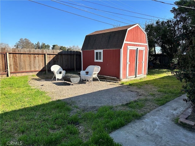 view of shed with a fenced backyard