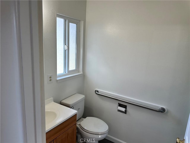 bathroom with toilet and vanity