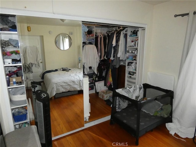 bedroom featuring a closet and wood finished floors