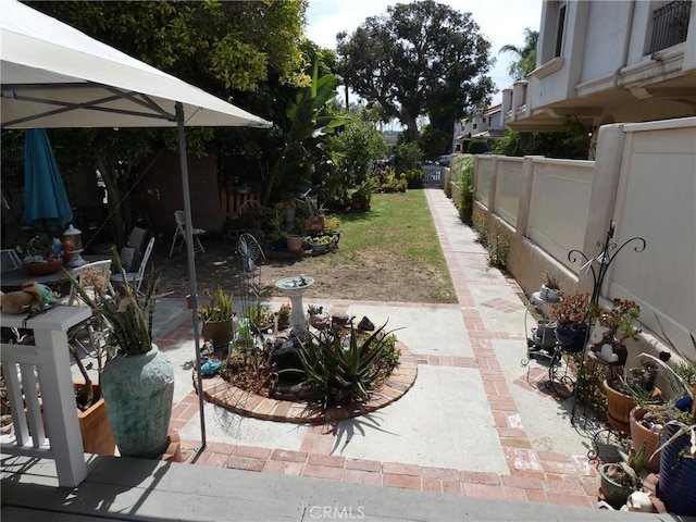 view of yard with a patio area and fence