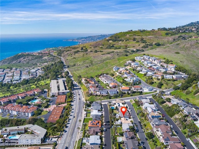 birds eye view of property featuring a water view and a residential view