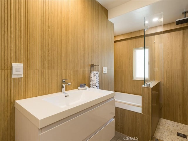 bathroom featuring vanity and an enclosed shower