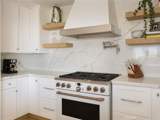 kitchen with open shelves, premium range hood, white range oven, and white cabinets