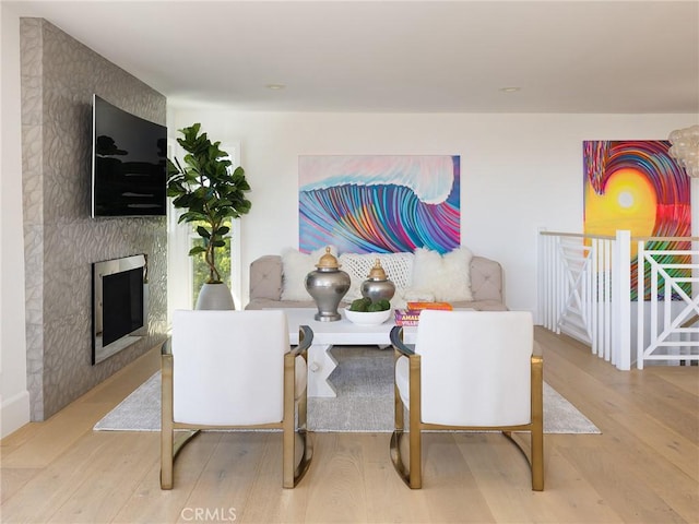 living room featuring a fireplace and wood finished floors