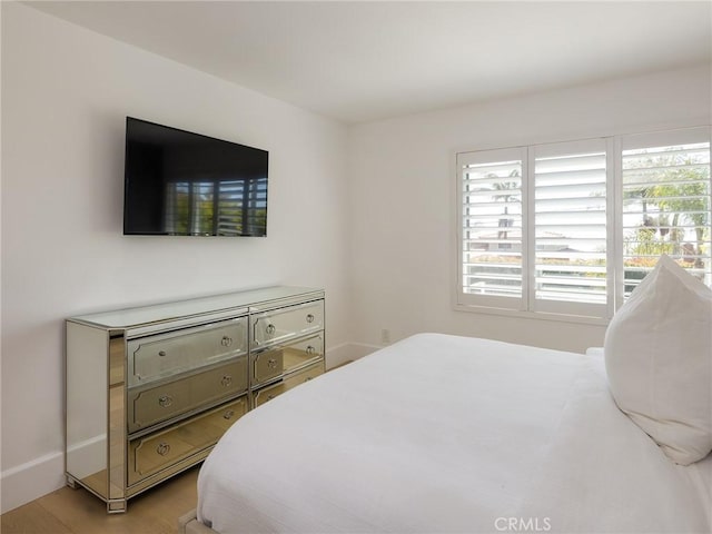 bedroom with light wood-style flooring