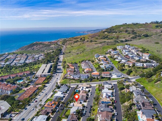 bird's eye view featuring a water view and a residential view