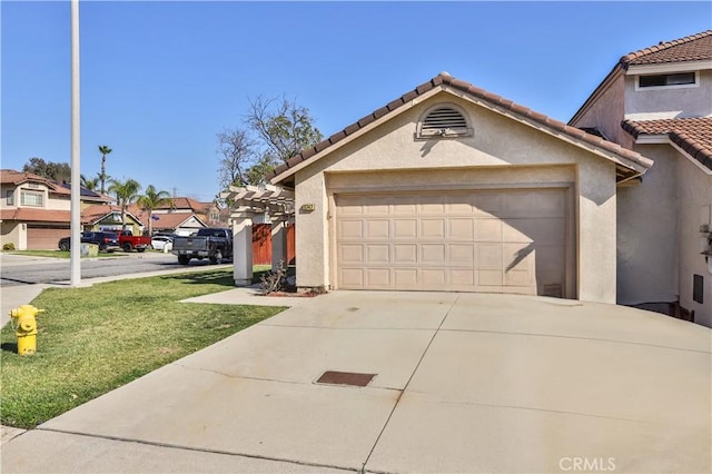 view of front of property featuring a garage, a tiled roof, concrete driveway, a residential view, and stucco siding