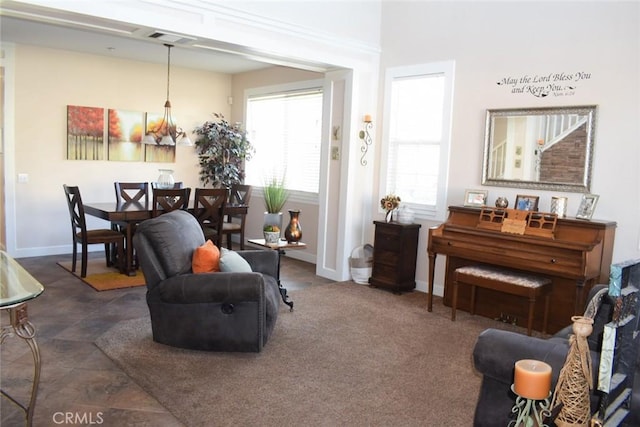 living room with visible vents and baseboards