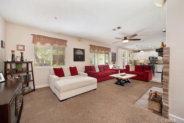 living area with ceiling fan, carpet, baseboards, visible vents, and recessed lighting