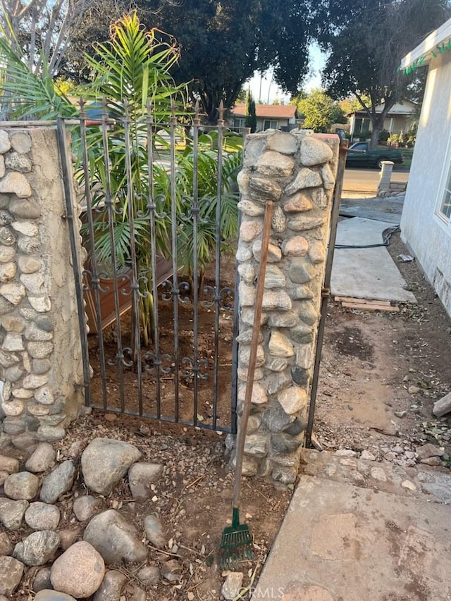 view of gate featuring fence