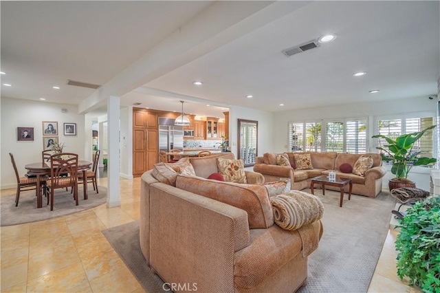 living area featuring recessed lighting, visible vents, baseboards, and light tile patterned floors