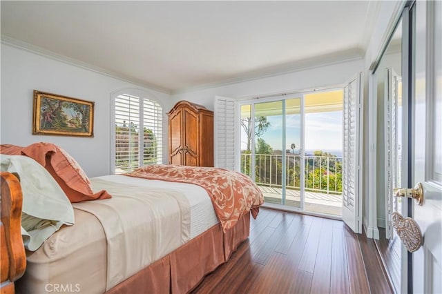 bedroom with dark wood-style floors, access to outside, and ornamental molding