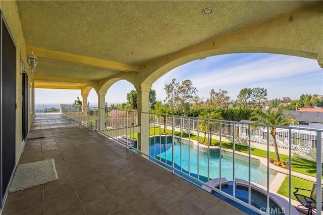 view of swimming pool with a patio, a fenced backyard, a fenced in pool, and a hot tub