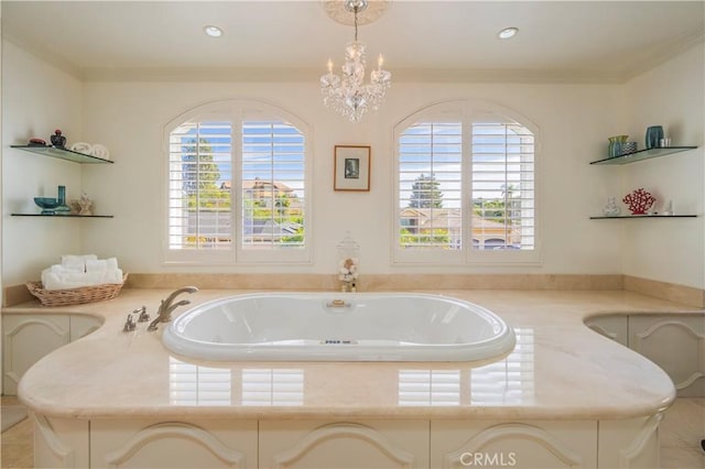 full bathroom featuring ornamental molding, recessed lighting, a bath, and an inviting chandelier