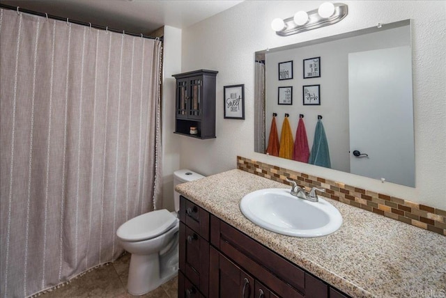 bathroom with toilet, tile patterned floors, decorative backsplash, and vanity