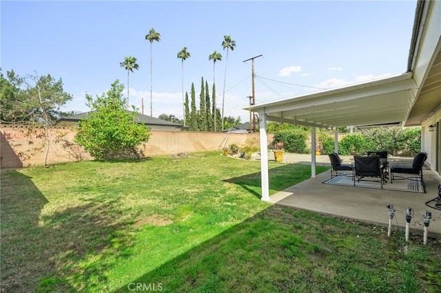 view of yard featuring a patio and a fenced backyard