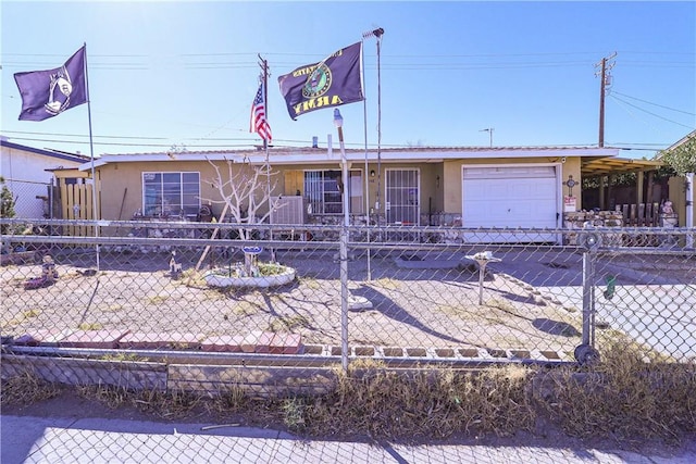 single story home with an attached garage, fence, and stucco siding