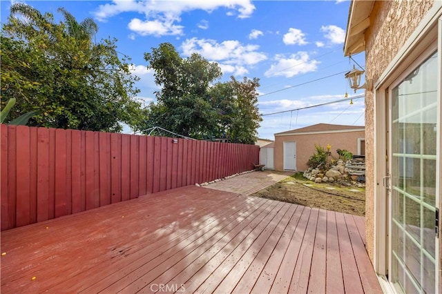 wooden deck featuring a fenced backyard