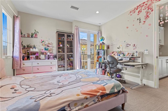 bedroom with baseboards, visible vents, light colored carpet, access to exterior, and french doors