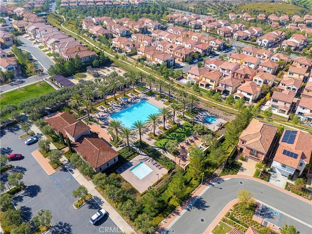 birds eye view of property with a residential view