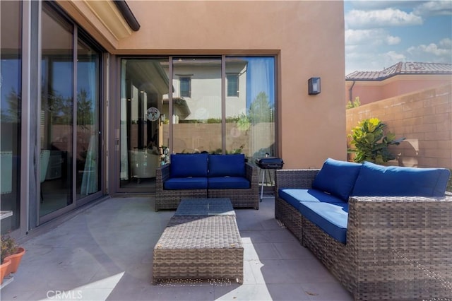 view of patio with fence and an outdoor living space