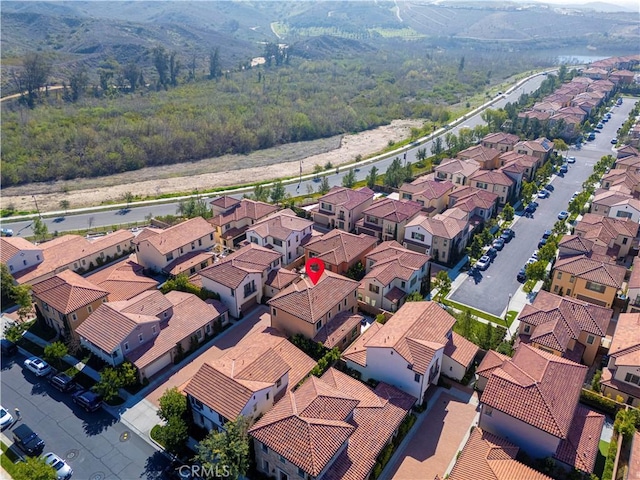 birds eye view of property with a residential view