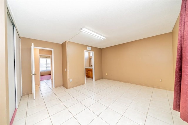 empty room featuring light tile patterned flooring