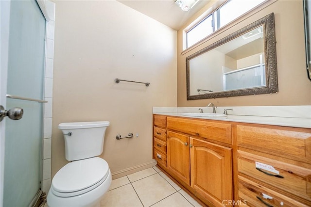 full bathroom with toilet, a shower with shower door, vanity, and tile patterned floors