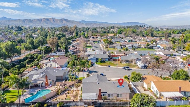 birds eye view of property with a residential view and a mountain view