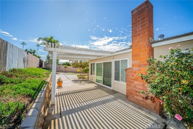 view of patio with fence and a pergola