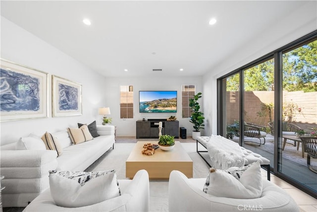 living area featuring recessed lighting and visible vents